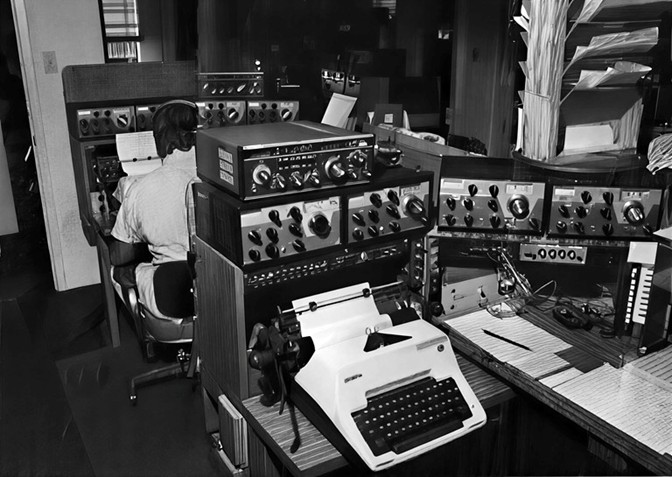 2 operating positions, one behind the other - typewriter in forground - multiple pieces of Drake gear - mostly R4 vintage, but 1 TR-7 also showing